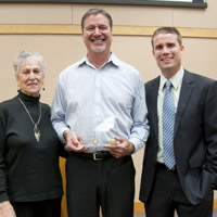 Rick Dean receiving his Jefferson Award from Supervisor McGuire